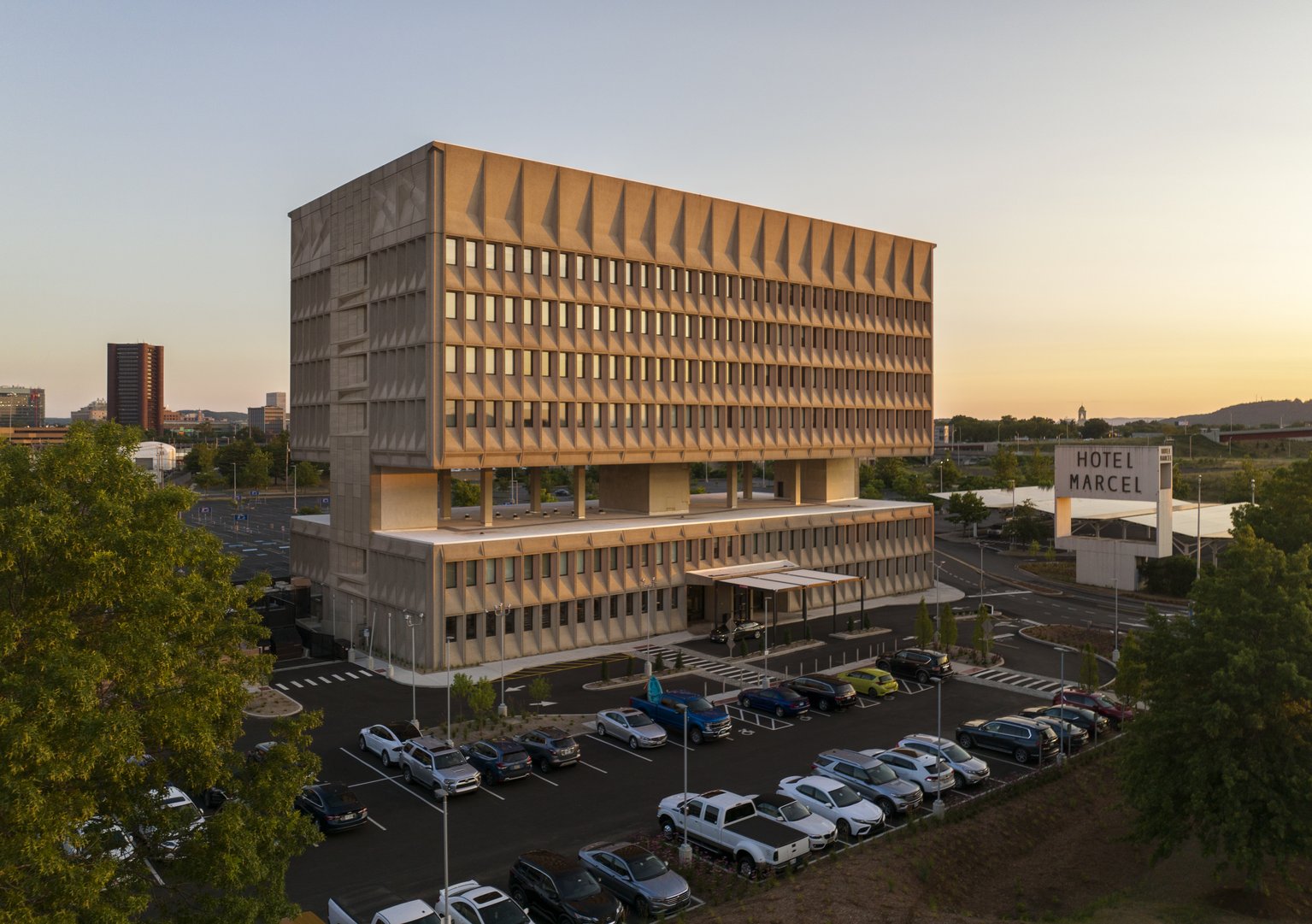 Hotel Marcel - Exteriors - Full - Dawn Angle Aerials Framed by Trees copy.jpg